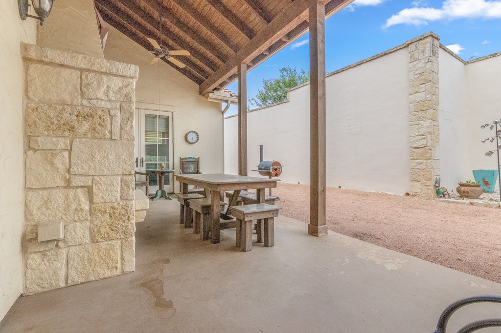 3801-1 Club House Road Kerrville, TX 78028 - Photo 21 of 26 a view of a patio with table and chairs