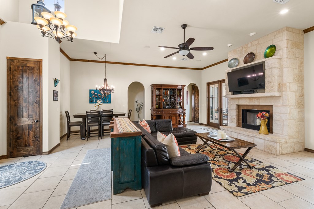 3801-1 Club House Road Kerrville, TX 78028 - Photo 3 of 26 a living room with fireplace furniture and a flat screen tv