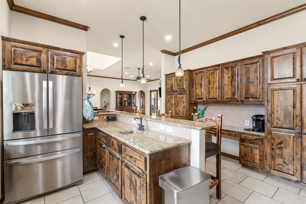 3801-1 Club House Road Kerrville, TX 78028 - Photo 5 of 26 a kitchen with a sink stainless steel appliances and cabinets