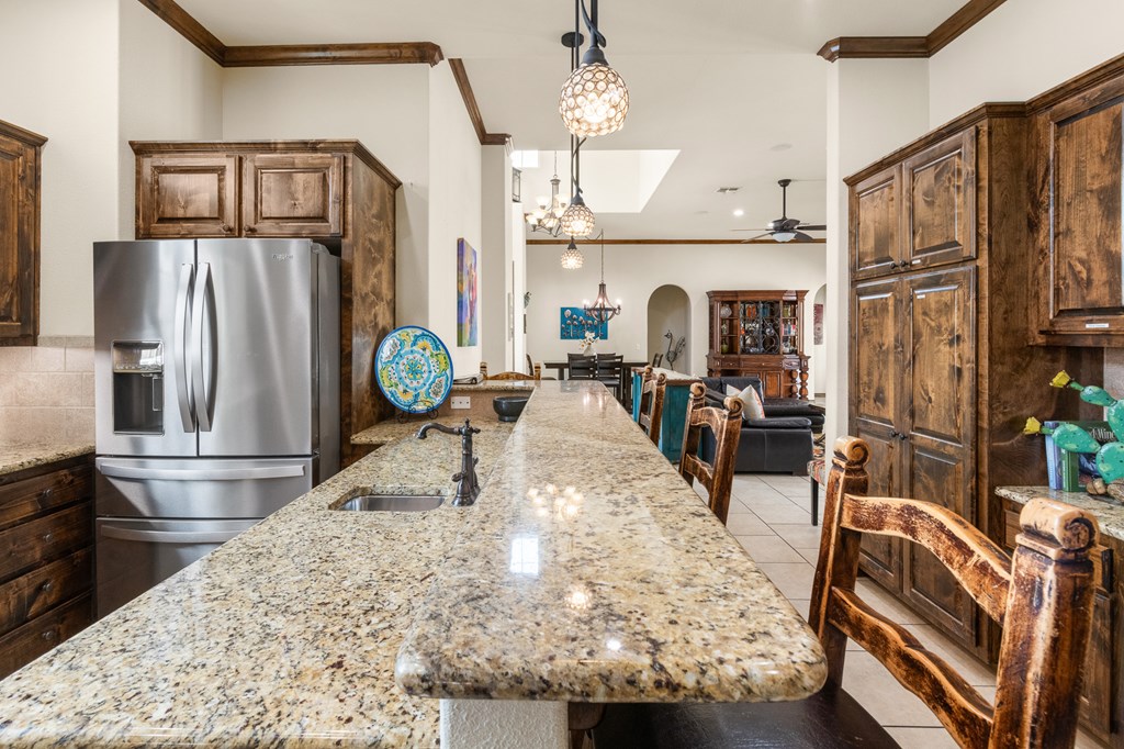 3801-1 Club House Road Kerrville, TX 78028 - Photo 7 of 26 a view of living room kitchen with furniture and a fireplace