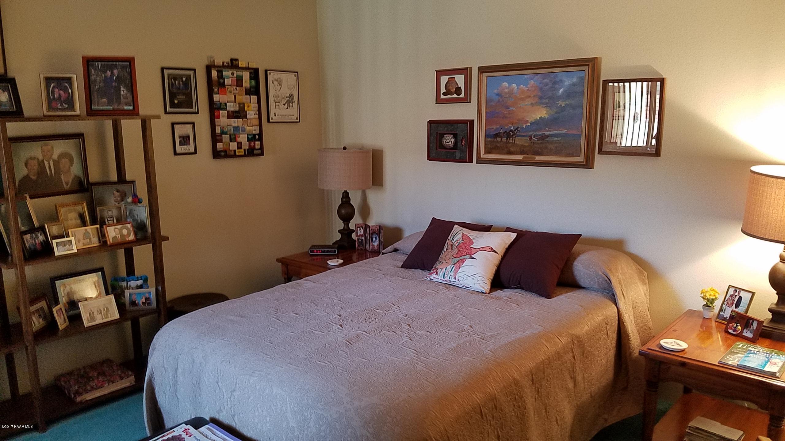 428 River Oaks Road Prescott, AZ 86301 - Photo 14 of 17 a bed room with a bed and furniture