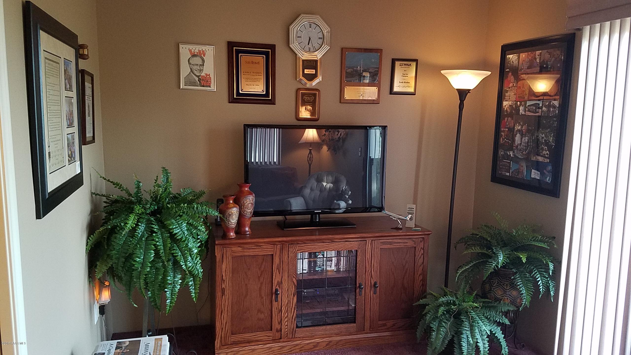 428 River Oaks Road Prescott, AZ 86301 - Photo 16 of 17 a living room with furniture and a potted plant