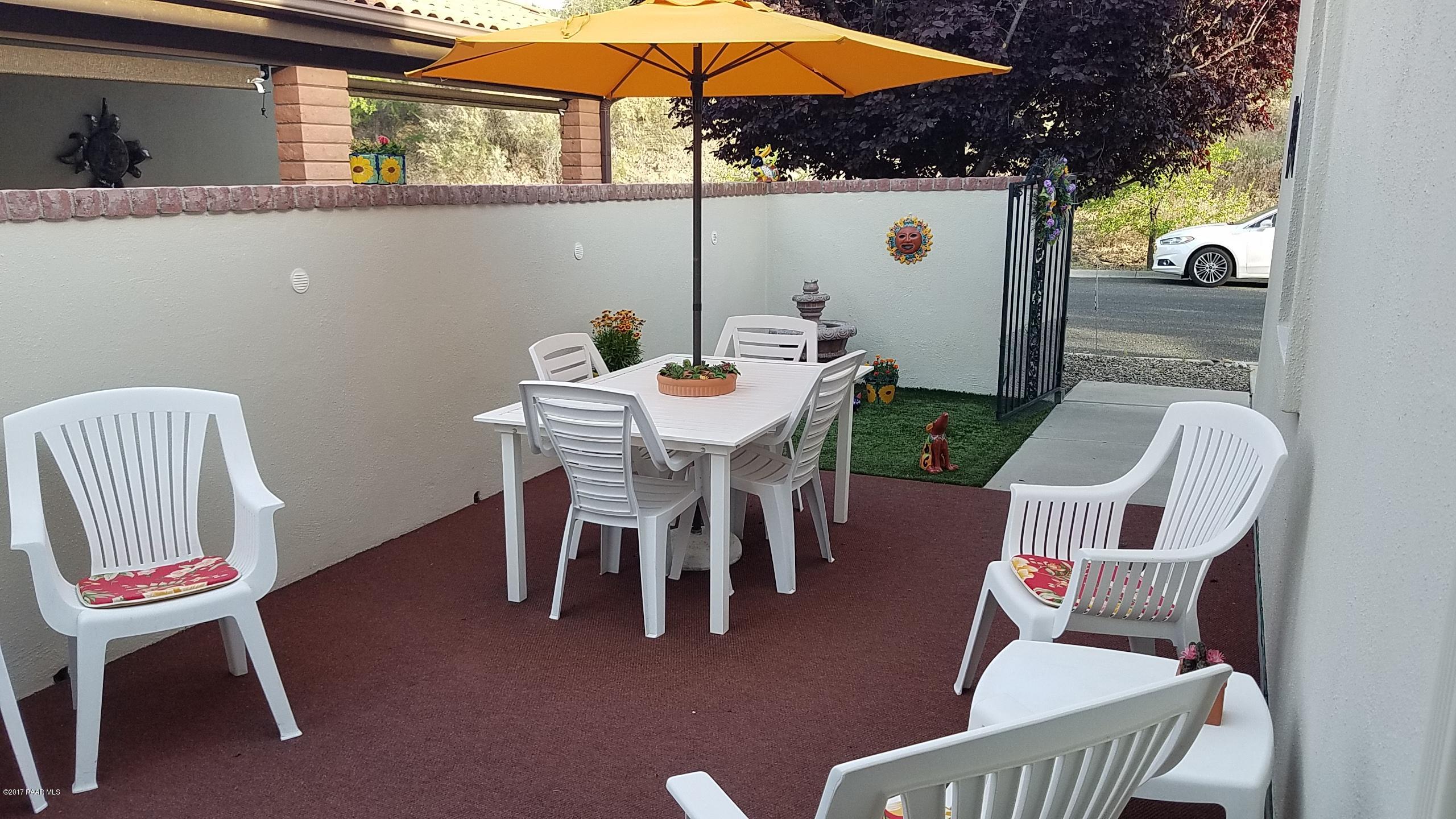 428 River Oaks Road Prescott, AZ 86301 - Photo 4 of 17 a view of a dining room with furniture and chandelier