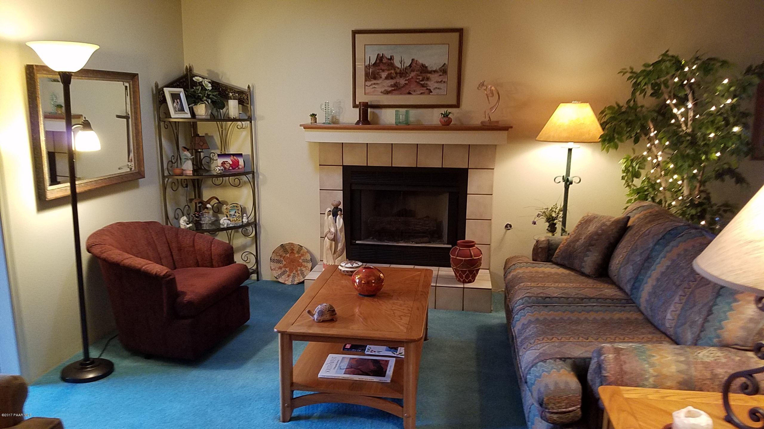 428 River Oaks Road Prescott, AZ 86301 - Photo 8 of 17 a living room with furniture and a fireplace