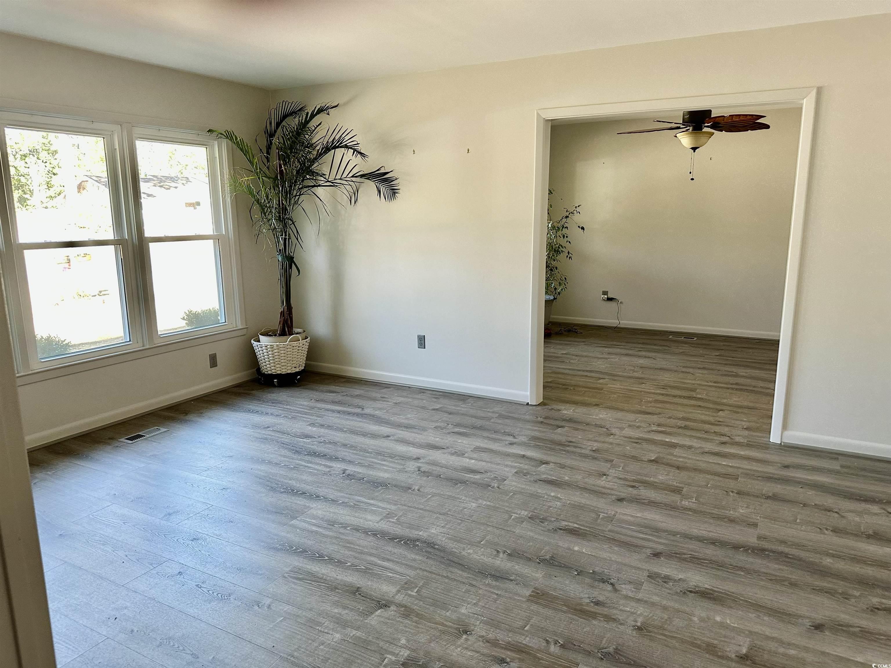 68 Mallard Circle Georgetown, SC 29440 - Photo 14 of 24 Unfurnished room with wood finished floors and a ceiling fan