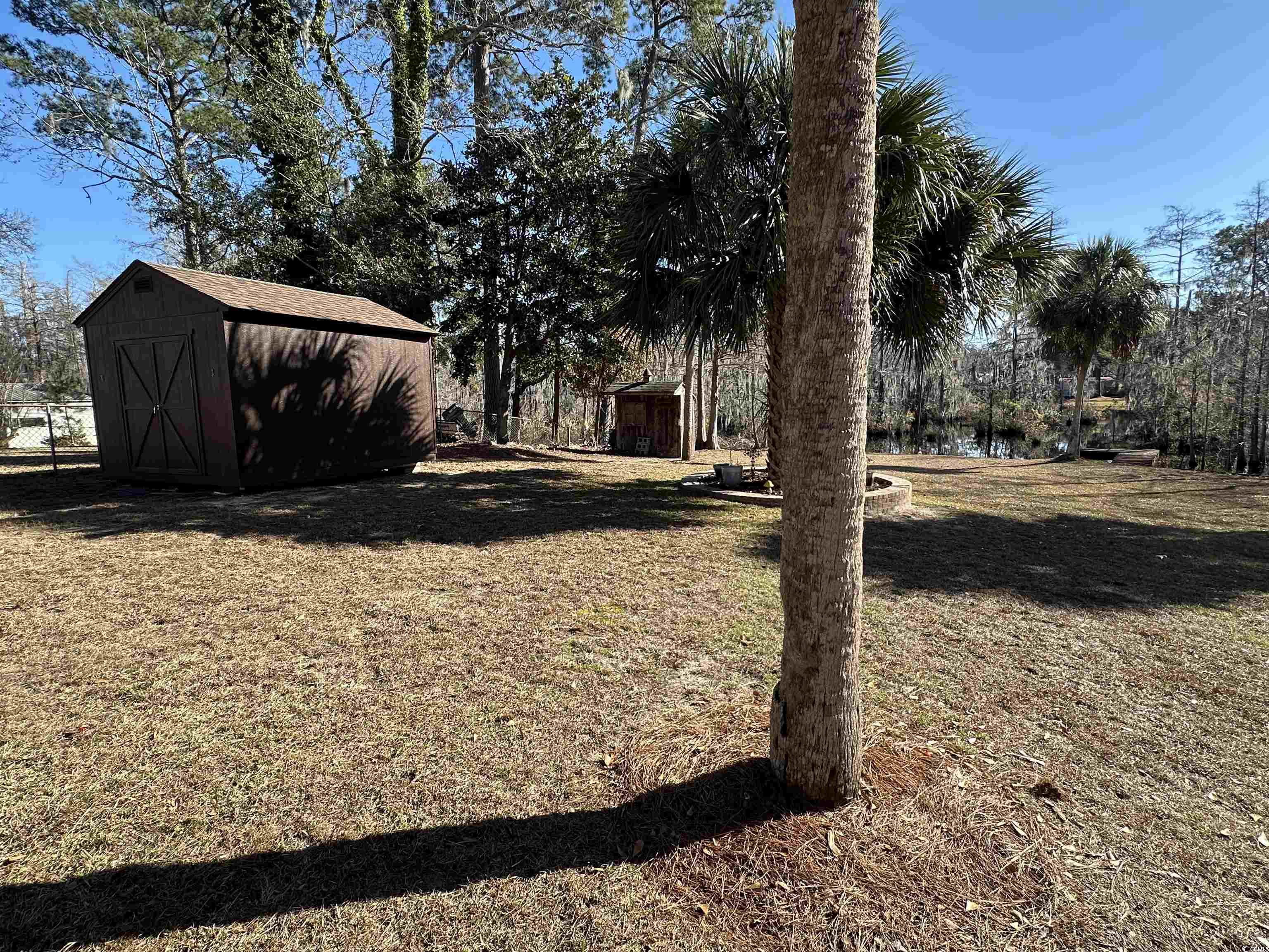 68 Mallard Circle Georgetown, SC 29440 - Photo 10 of 24 View of grassy yard with a storage unit