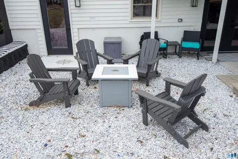a front view of a house with a yard and plant