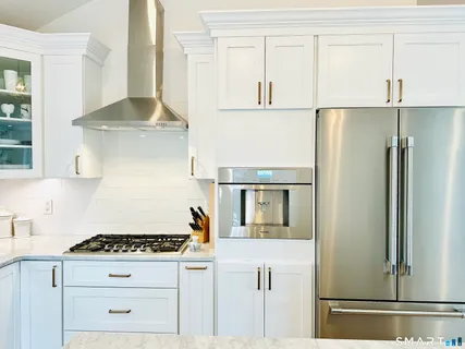 a kitchen with cabinets and appliances