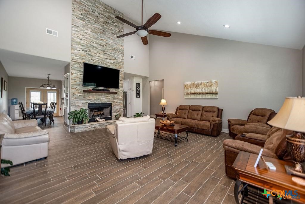 802 Mc Donald Road Port Lavaca, TX 77979 - Photo 11 of 45 a living room with furniture a flat screen tv and a fireplace