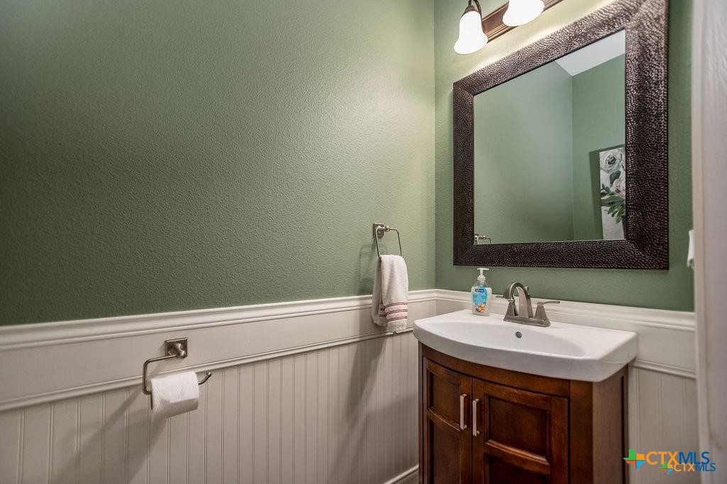 802 Mc Donald Road Port Lavaca, TX 77979 - Photo 20 of 45 a bathroom with a sink a vanity and a mirror