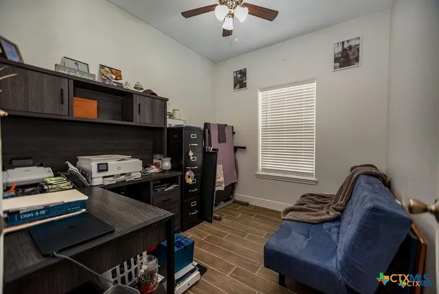 a bedroom with a bed and a tv