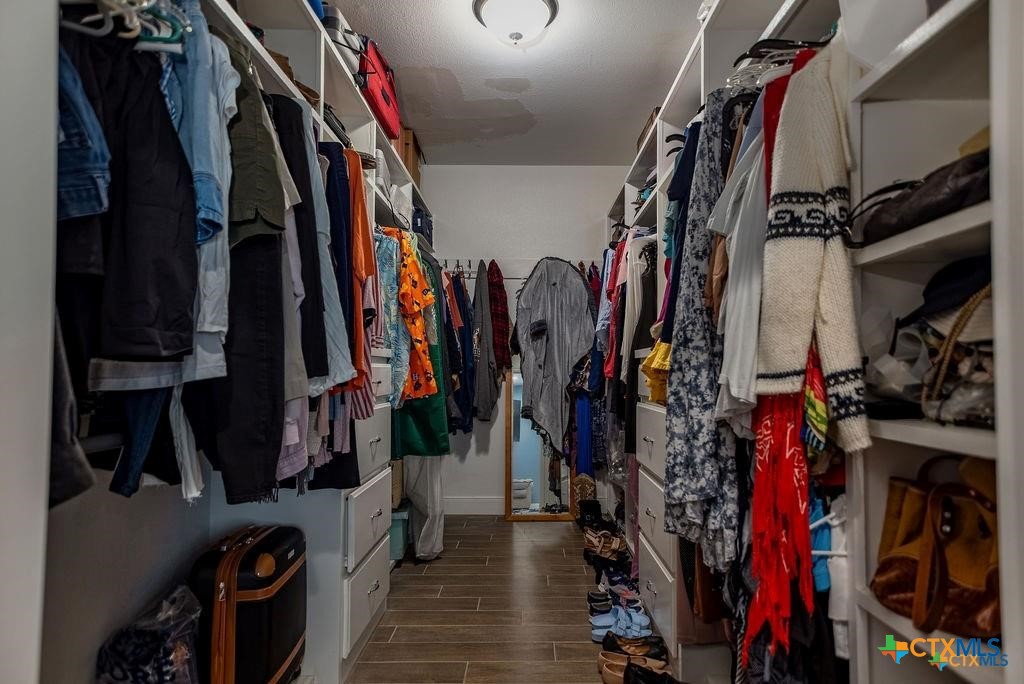 802 Mc Donald Road Port Lavaca, TX 77979 - Photo 23 of 44 a view of walk in closet with clothes