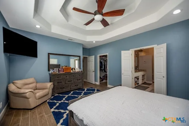 a view of walk in closet with clothes