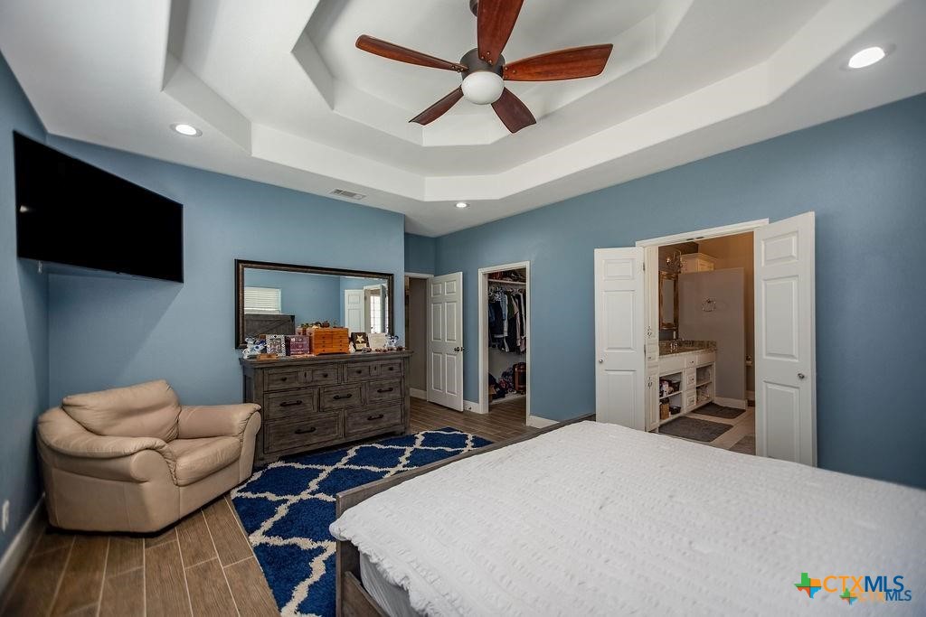 802 Mc Donald Road Port Lavaca, TX 77979 - Photo 23 of 45 a bedroom with furniture and a flat screen tv