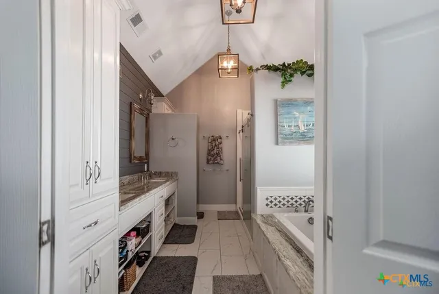 a bathroom with a bathtub and a shower