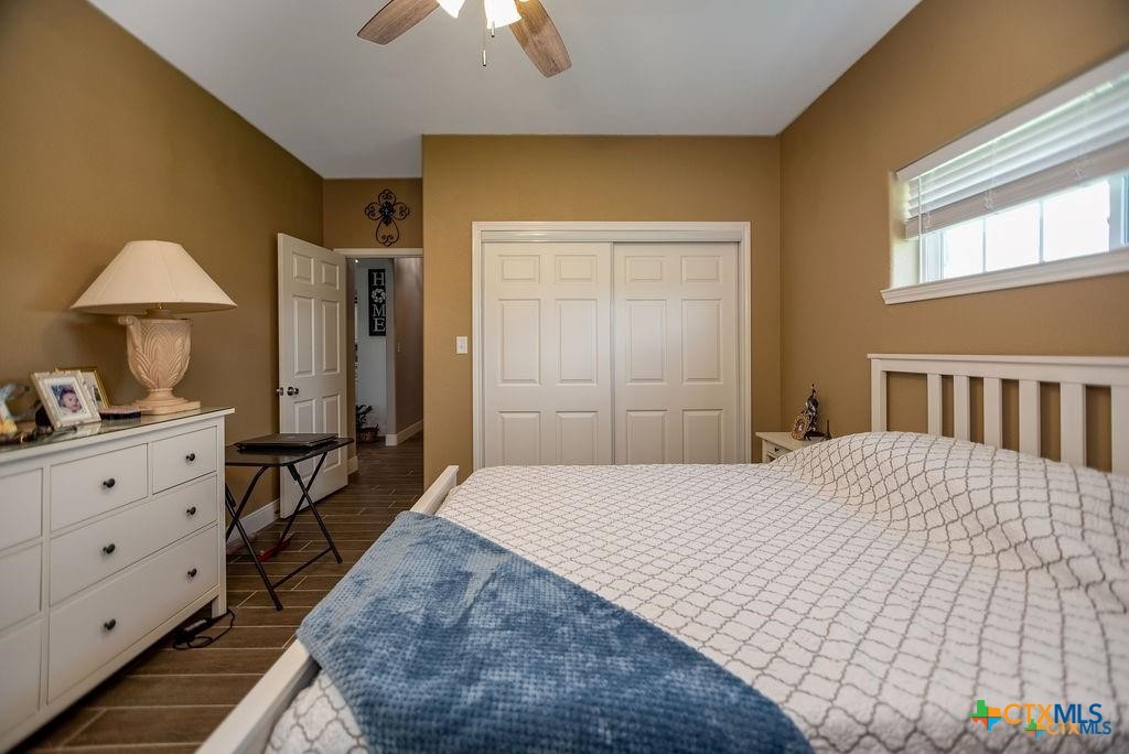 802 Mc Donald Road Port Lavaca, TX 77979 - Photo 32 of 45 a bedroom with a bed and a dresser