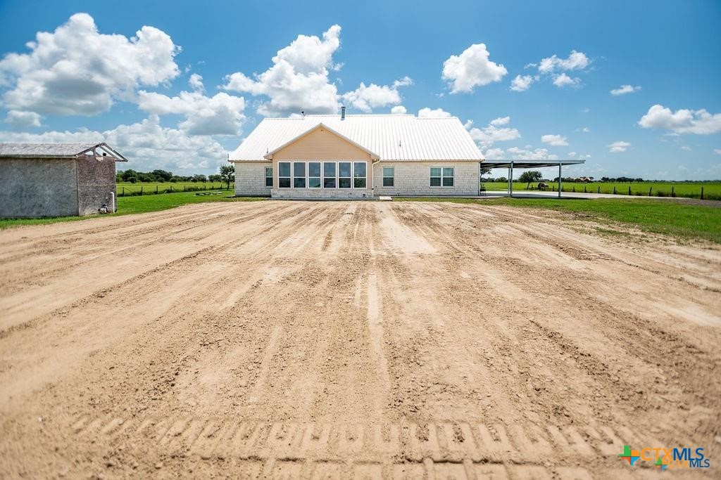 802 Mc Donald Road Port Lavaca, TX 77979 - Photo 41 of 45 a front view of a house with a yard and a garden