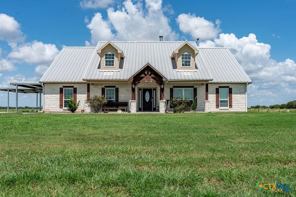 802 Mc Donald Road Port Lavaca, TX 77979 - Photo 5 of 44 a front view of a house with a garden