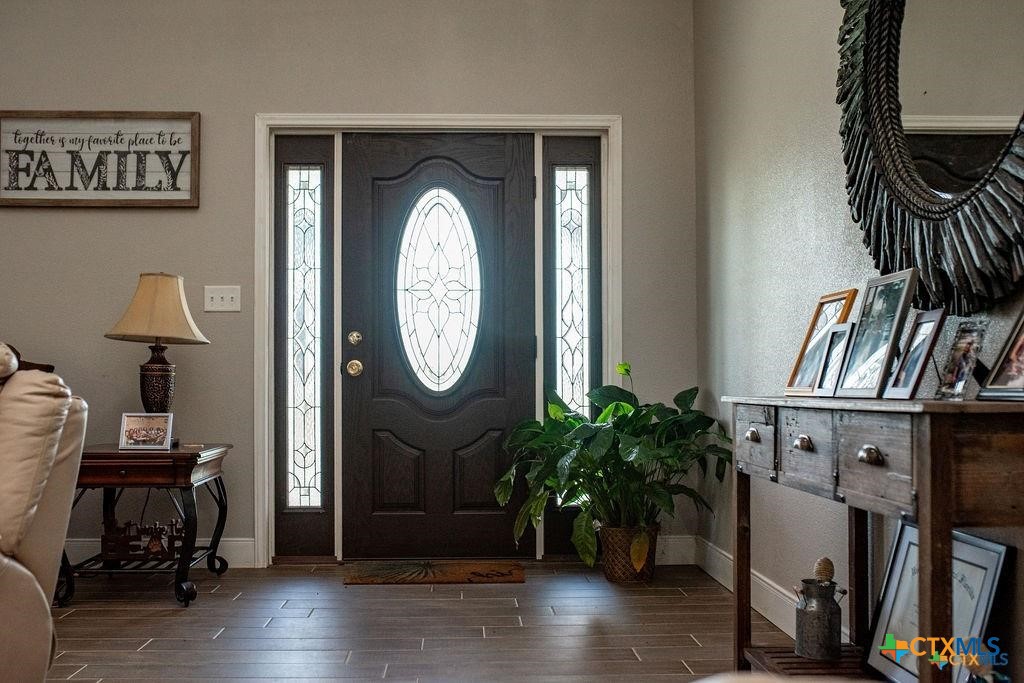 802 Mc Donald Road Port Lavaca, TX 77979 - Photo 10 of 45 a living room with furniture and a wooden floor