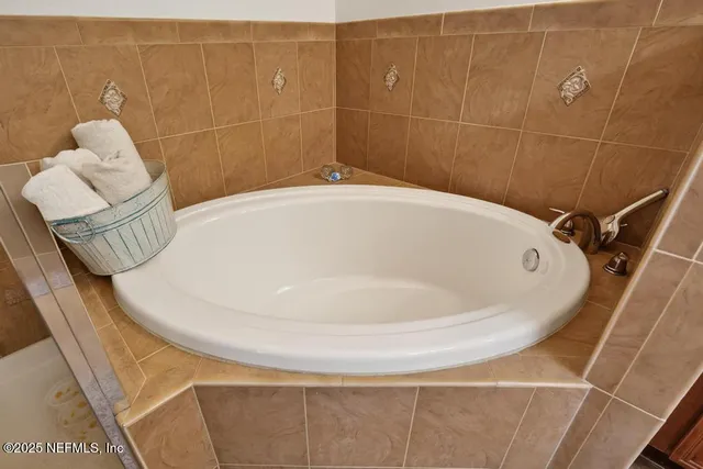 a front view of a house with garden and porch