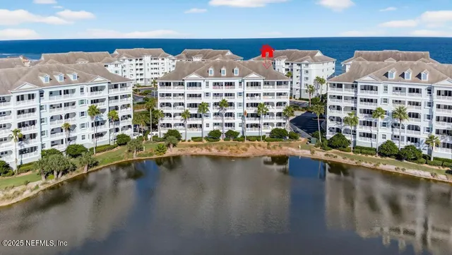 a view of a house with swimming pool and dining chair