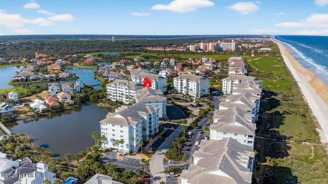 a view of a swimming pool with outdoor seating