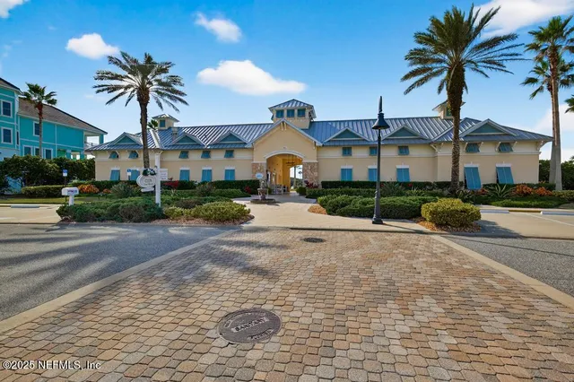 a view of a patio with couches chairs and wooden floor