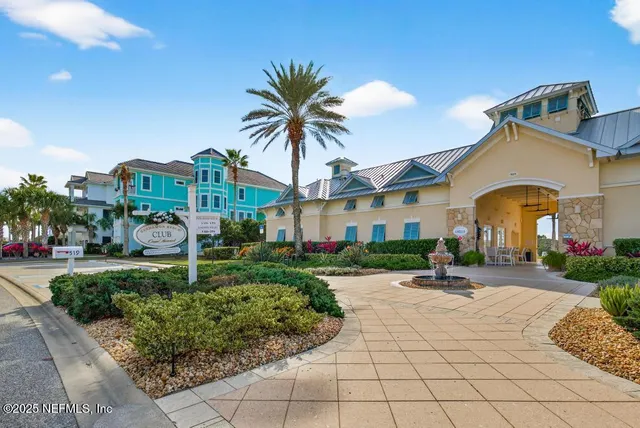 a view of a lake with couches and wooden floor