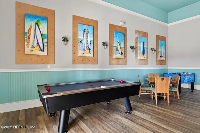 a living room with furniture a flat screen tv and a large window