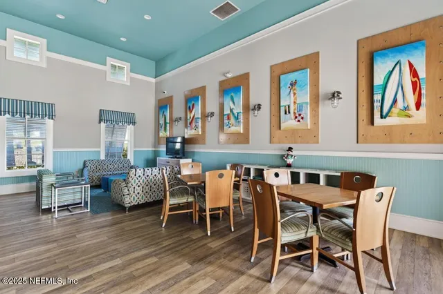 a view of a swimming pool with outdoor seating