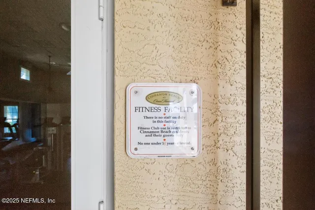 an aerial view of a house with garden space and a lake view