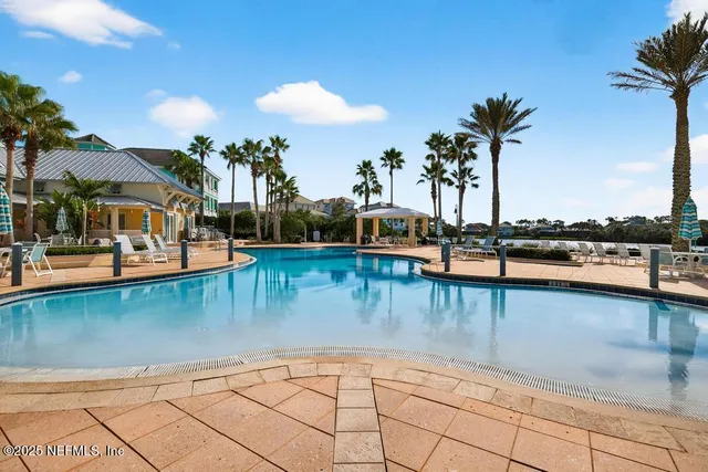 a view of a swimming pool with a patio
