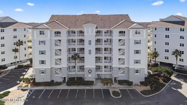 a kitchen with granite countertop wooden cabinets and stainless steel appliances