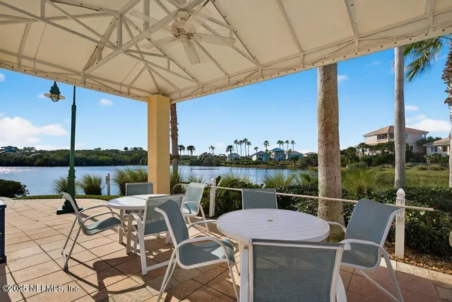 a swimming pool with outdoor seating