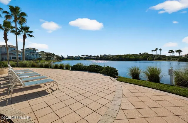 a view of a swimming pool with a table and chairs