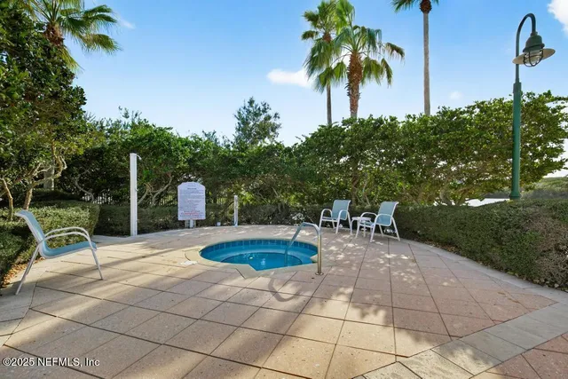 a view of a hallway view with wooden floor and living room