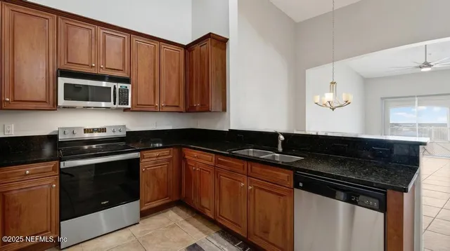 a spacious bathroom with a granite countertop sink mirror and bathtub