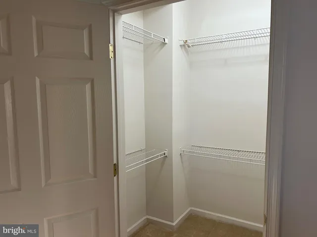 a bathroom with a double vanity sink toilet and a mirror