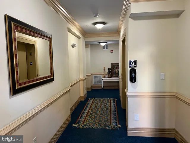 a kitchen with a refrigerator and a stove