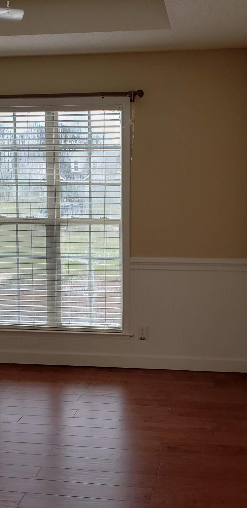 515 Amanda Way Macon, GA 31216 - Photo 11 of 33 a view of wooden floor and windows in a room