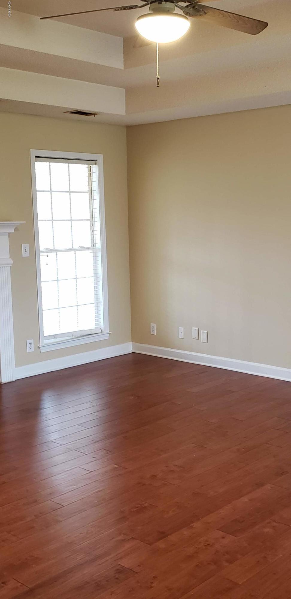 515 Amanda Way Macon, GA 31216 - Photo 12 of 33 a view of a room with wooden floor and window