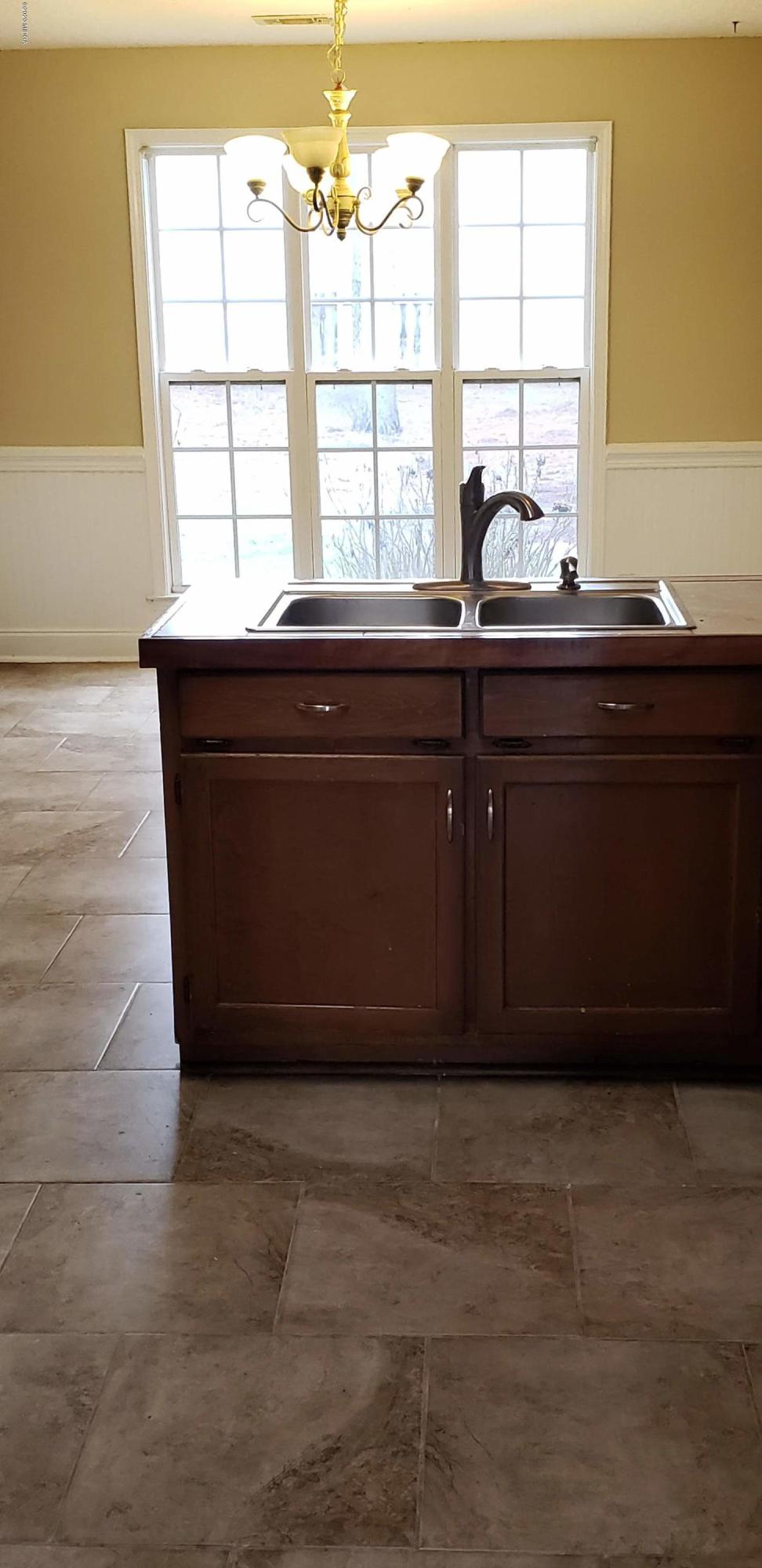 515 Amanda Way Macon, GA 31216 - Photo 16 of 33 a bathroom with a sink and a window