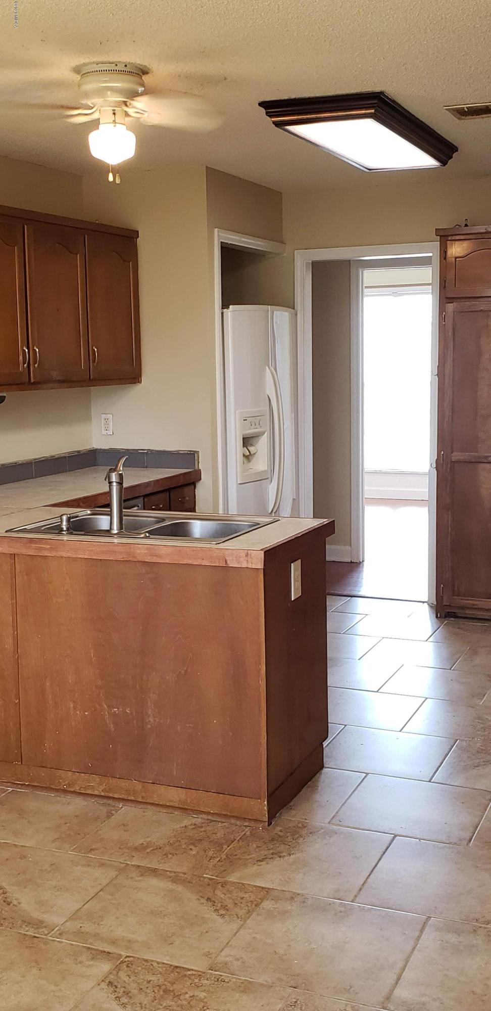 515 Amanda Way Macon, GA 31216 - Photo 17 of 33 a room with stainless steel appliances granite countertop a sink and a cabinets