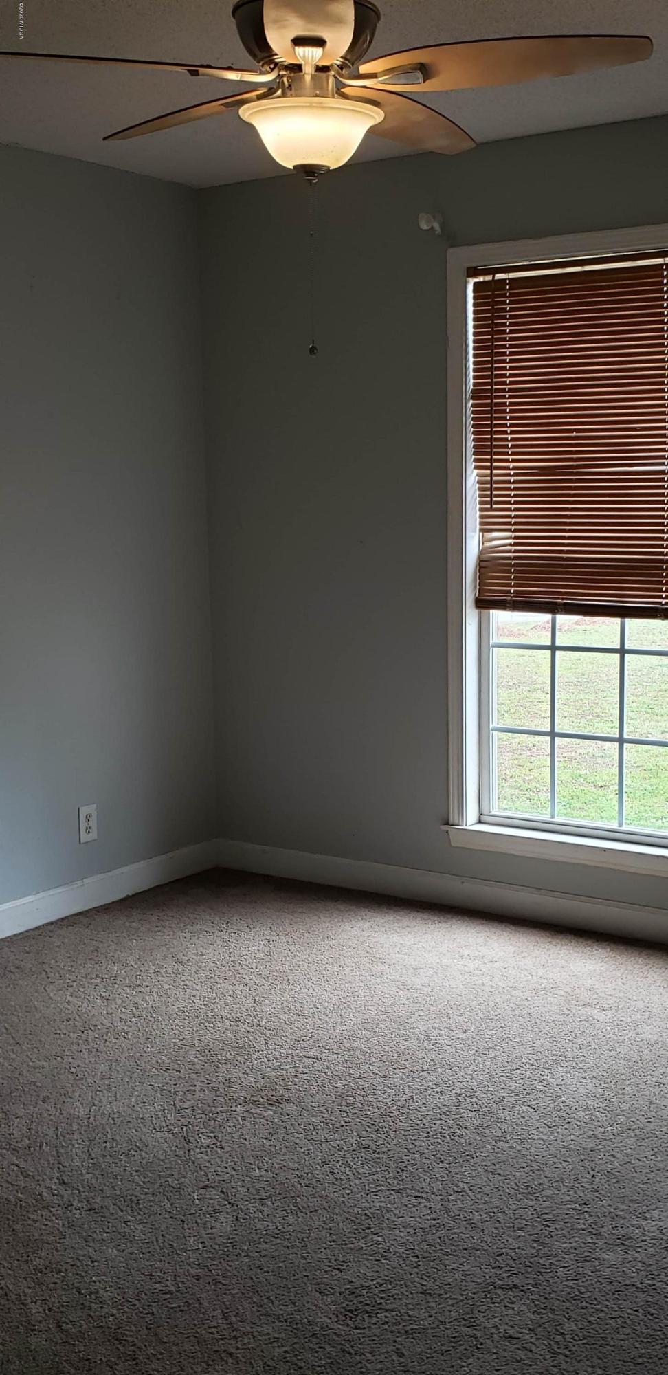 515 Amanda Way Macon, GA 31216 - Photo 19 of 33 a view of a livingroom with an empty space and a window