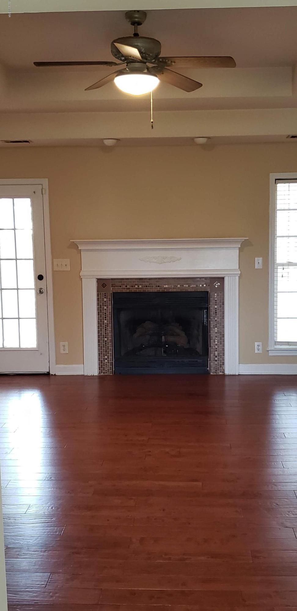 515 Amanda Way Macon, GA 31216 - Photo 7 of 33 a view of empty room with wooden floor and fireplace