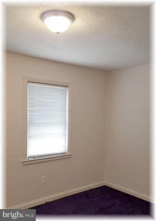 8308 Dalesford Road Baltimore, MD 21234 - Photo 15 of 25 Large rear bedroom w/hardwood under the carpet.
