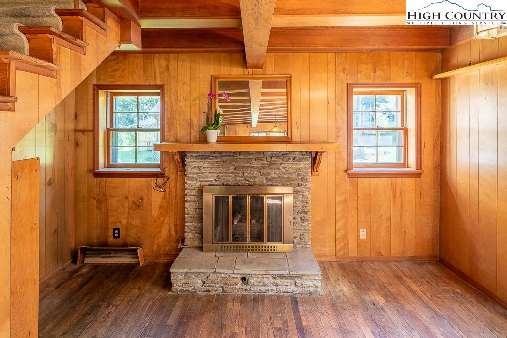 492 Payne Branch Road Boone, NC 28607 - Photo 17 of 49 a view of a livingroom with wooden floor and a fireplace