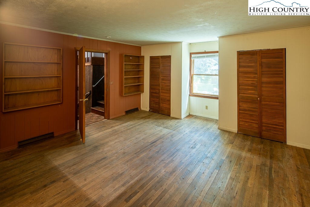 492 Payne Branch Road Boone, NC 28607 - Photo 21 of 49 an empty room with wooden floor and closet