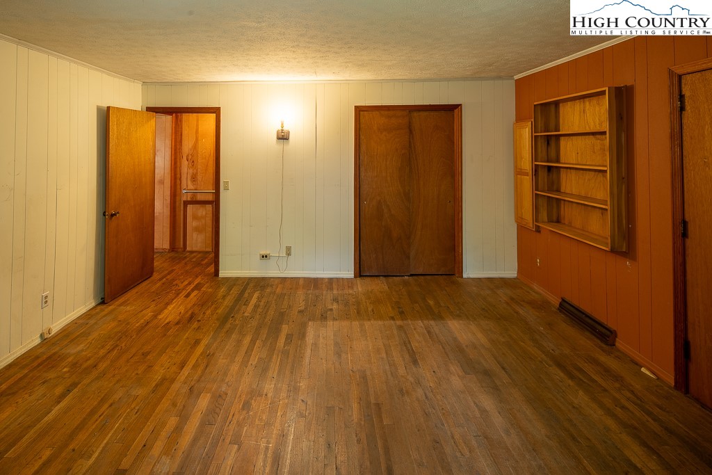 492 Payne Branch Road Boone, NC 28607 - Photo 24 of 49 a view of an empty room with wooden floor and a window