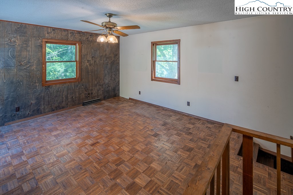 492 Payne Branch Road Boone, NC 28607 - Photo 30 of 49 an empty room with windows and fan
